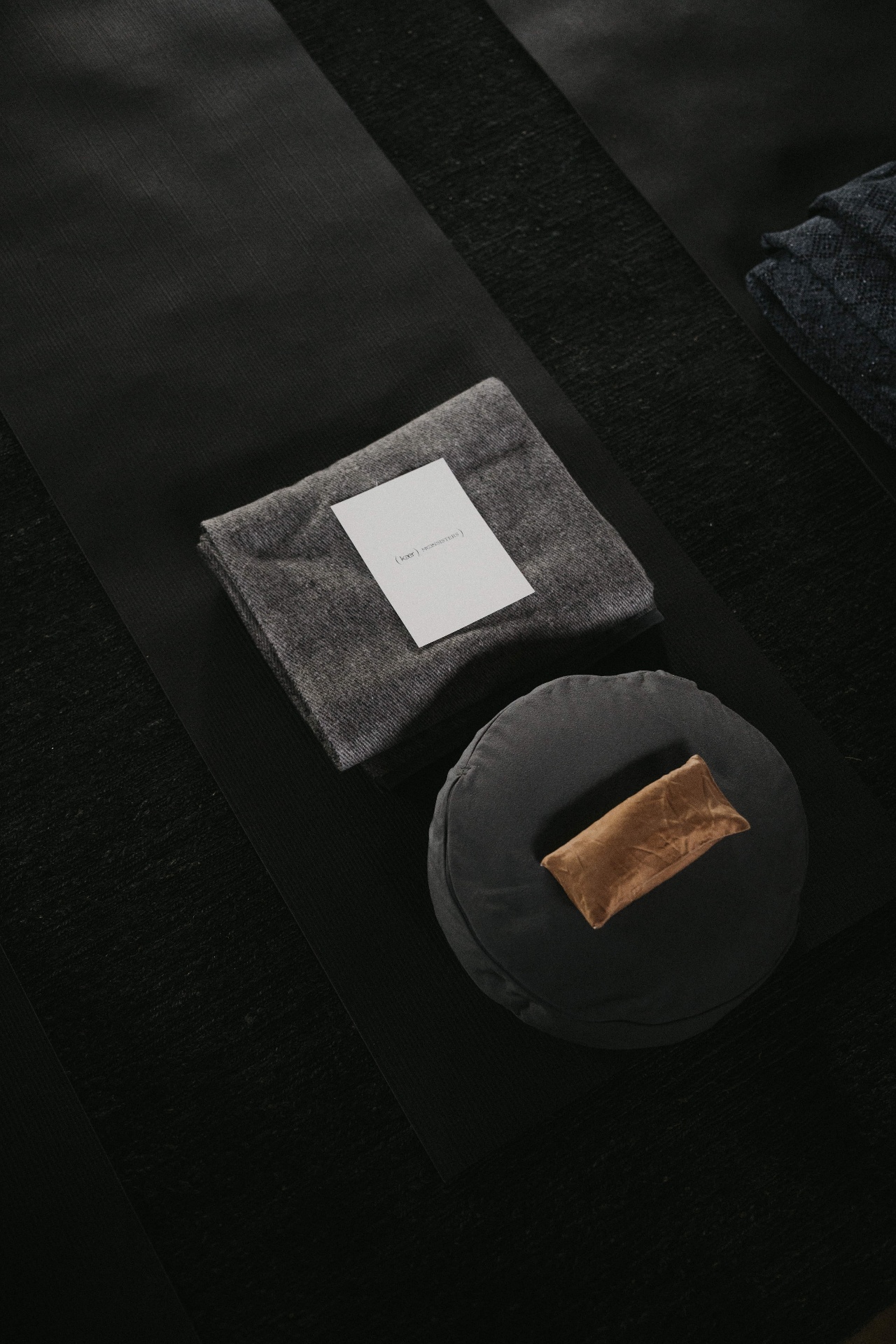 Retreat mat, folded blanket, and meditation cushion prepared for guests