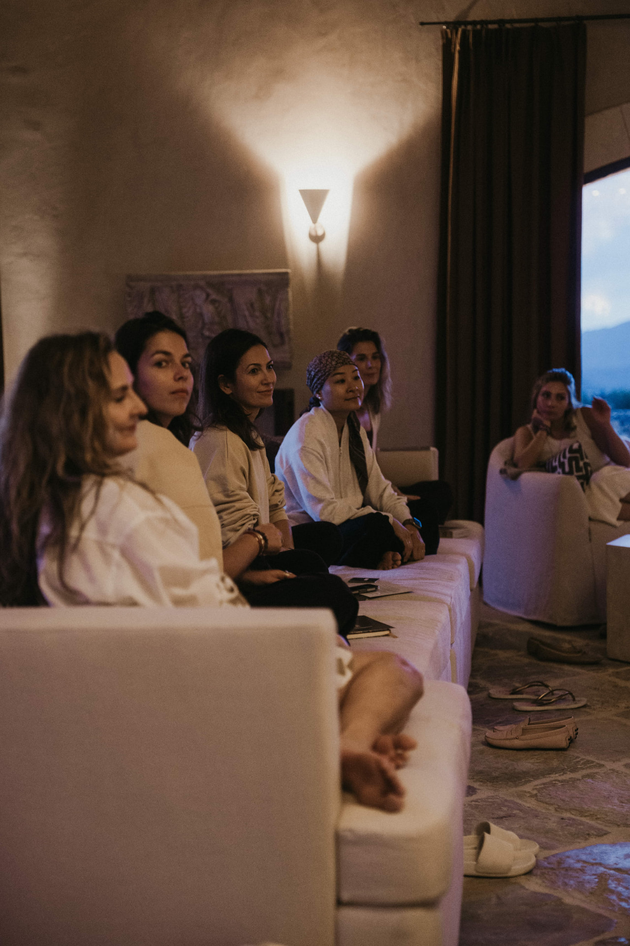 Evening circle in the living room at a Kaer retreat